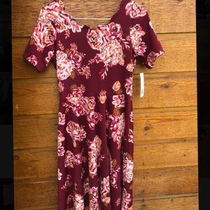 Floral print dress with a scalloped neckline!